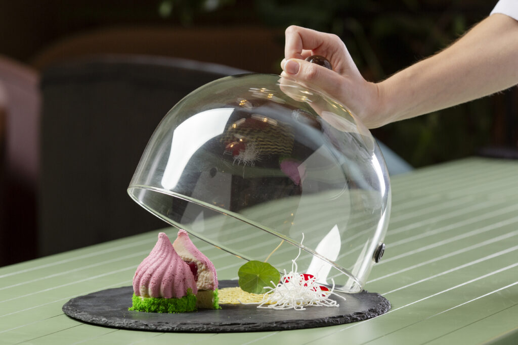 Front view of a delicious food arrangement covered safely to trap steam, keep meals moist, heat evenly, and maintain microwave cleanliness.