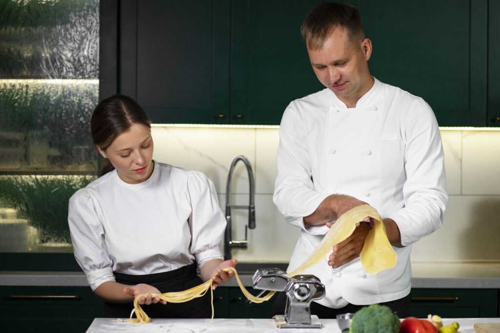 People making pasta, highlighting why measurement matters in cooking.